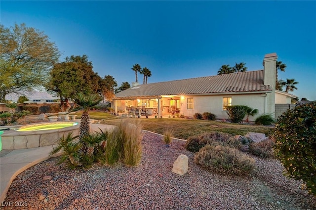 rear view of property with a patio