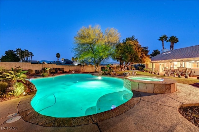 view of swimming pool featuring an in ground hot tub and a patio area