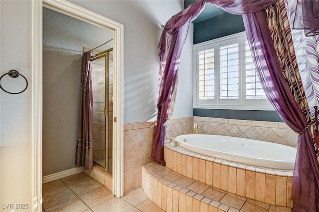 bathroom with independent shower and bath and tile patterned flooring