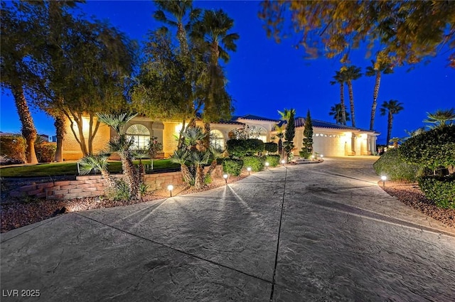 mediterranean / spanish-style house featuring a garage