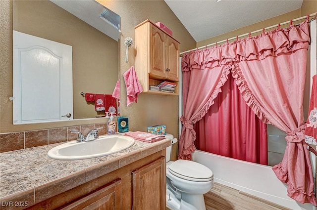 full bathroom featuring toilet, wood-type flooring, shower / bath combination with curtain, vanity, and lofted ceiling