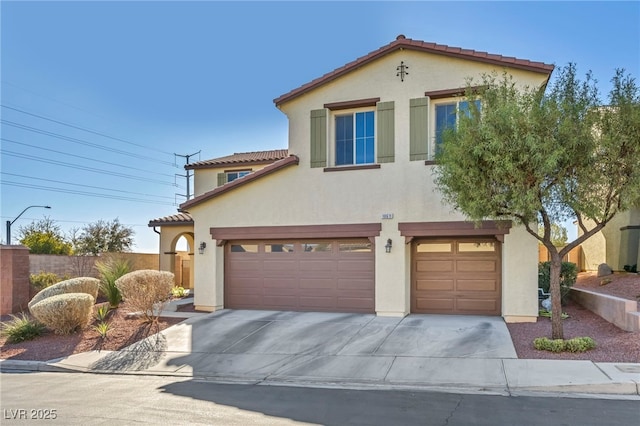 mediterranean / spanish-style home featuring a garage