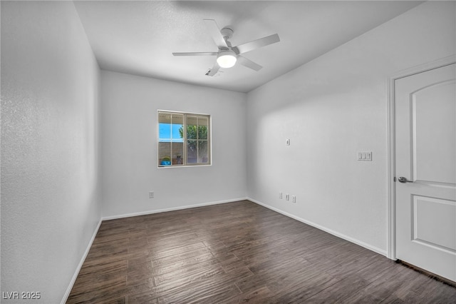 unfurnished room featuring ceiling fan and dark hardwood / wood-style floors