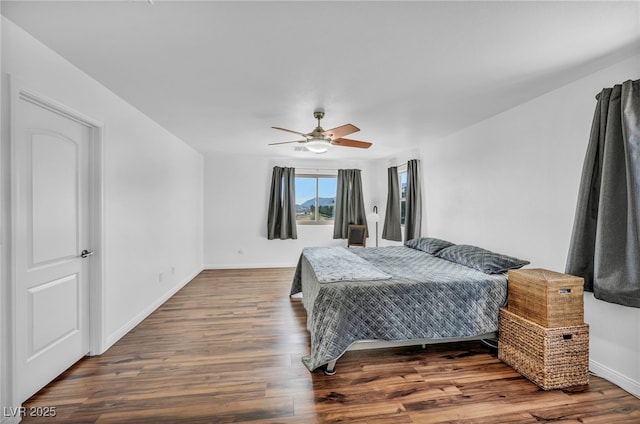 bedroom with hardwood / wood-style floors and ceiling fan