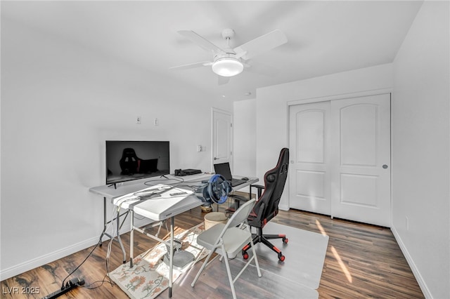 home office featuring hardwood / wood-style flooring and ceiling fan