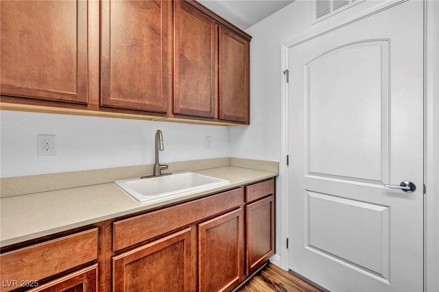 kitchen with sink and light wood-type flooring