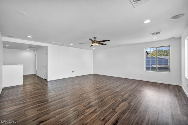 spare room with ceiling fan and dark hardwood / wood-style floors