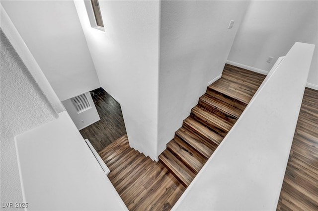 stairs with wood-type flooring