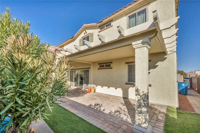 rear view of house featuring a patio