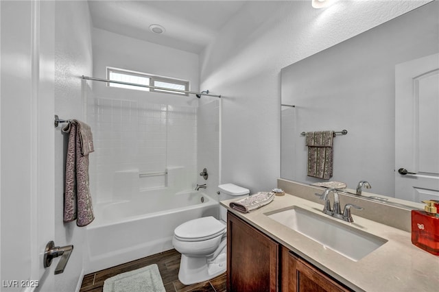 full bathroom featuring toilet, bathtub / shower combination, and vanity