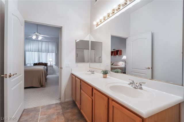 bathroom with ceiling fan and vanity