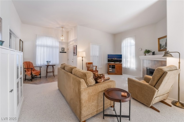 living room with a tiled fireplace