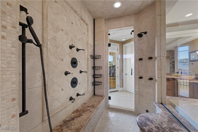 bathroom with vanity and a shower with door