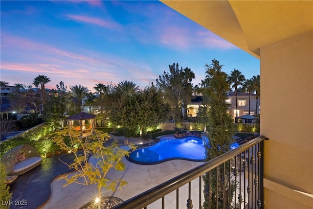 view of balcony at dusk