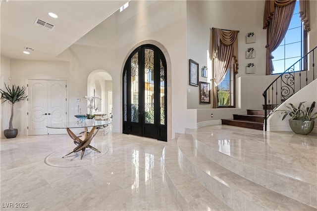 foyer entrance featuring a high ceiling