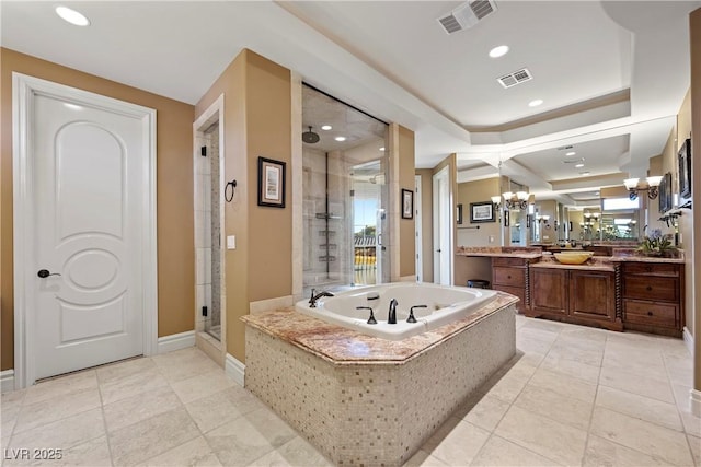 bathroom featuring independent shower and bath, a chandelier, tile patterned flooring, vanity, and a raised ceiling