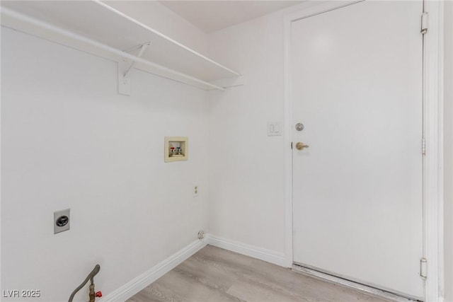 washroom featuring electric dryer hookup, washer hookup, and light hardwood / wood-style floors