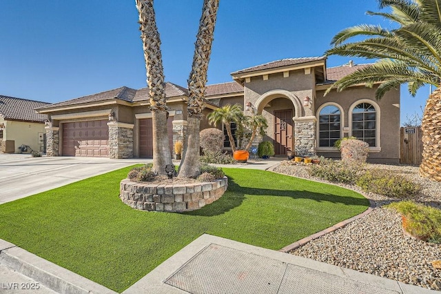 mediterranean / spanish-style house with a garage and a front yard