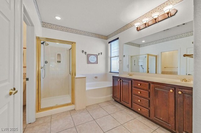 bathroom featuring vanity, tile patterned floors, and separate shower and tub