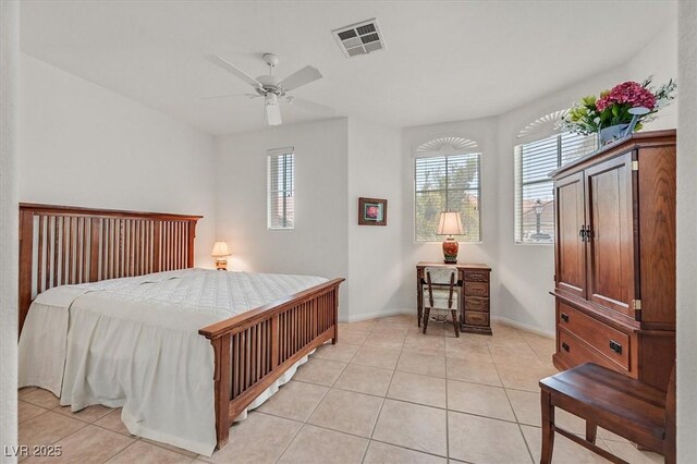 bedroom with light tile patterned floors and ceiling fan