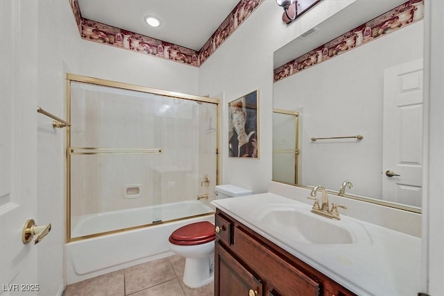 full bathroom featuring tile patterned flooring, vanity, bath / shower combo with glass door, and toilet