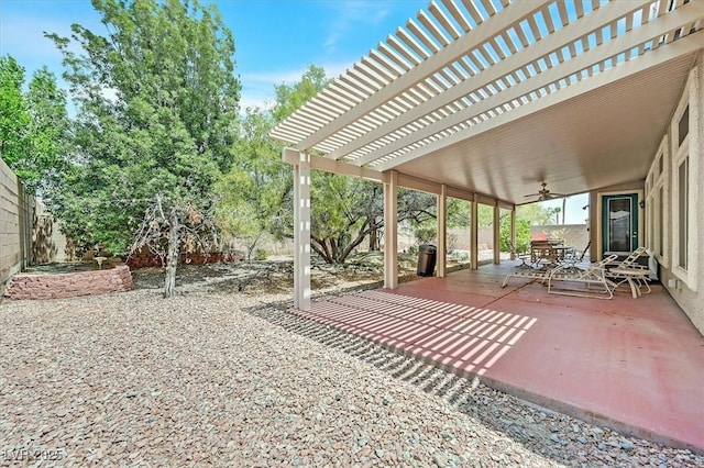 view of patio with ceiling fan and a pergola