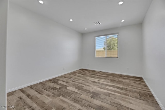 unfurnished room with light hardwood / wood-style flooring