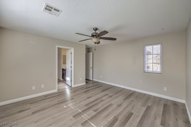 spare room featuring ceiling fan, a textured ceiling, and light wood-type flooring