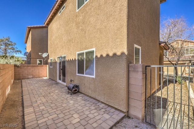 rear view of house featuring a patio