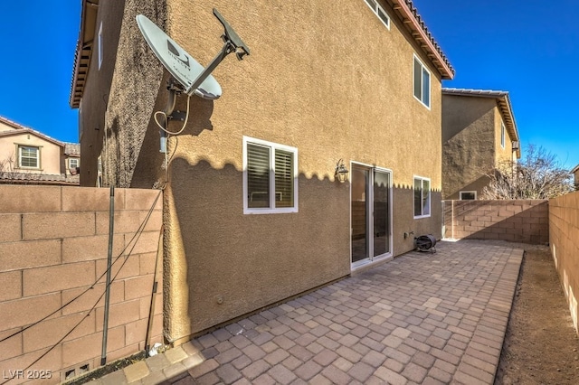 back of house featuring a patio area