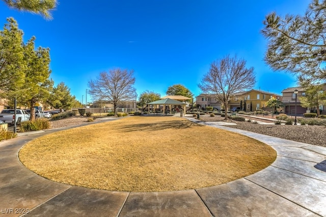 surrounding community featuring a gazebo and a lawn