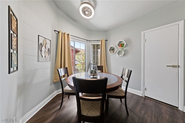 dining area with dark wood-type flooring