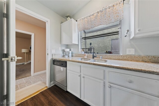 kitchen featuring sink, dark hardwood / wood-style floors, white cabinets, and dishwasher