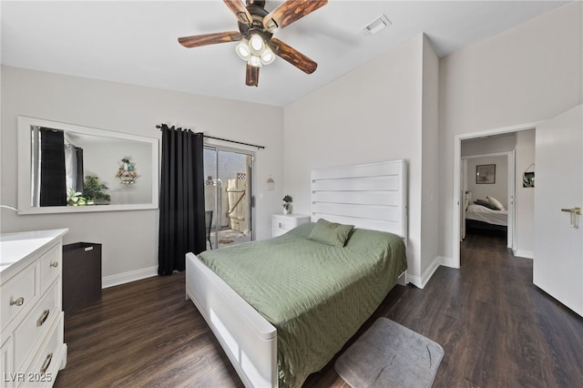 bedroom featuring dark hardwood / wood-style flooring, lofted ceiling, and ceiling fan