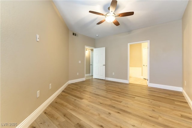 unfurnished bedroom with connected bathroom, light hardwood / wood-style flooring, and ceiling fan