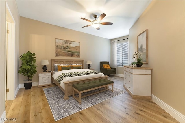 bedroom with ceiling fan and light hardwood / wood-style floors