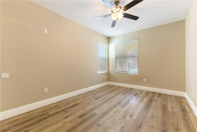 unfurnished room featuring ceiling fan and light wood-type flooring