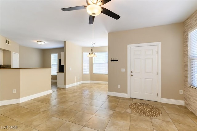 tiled foyer entrance with ceiling fan