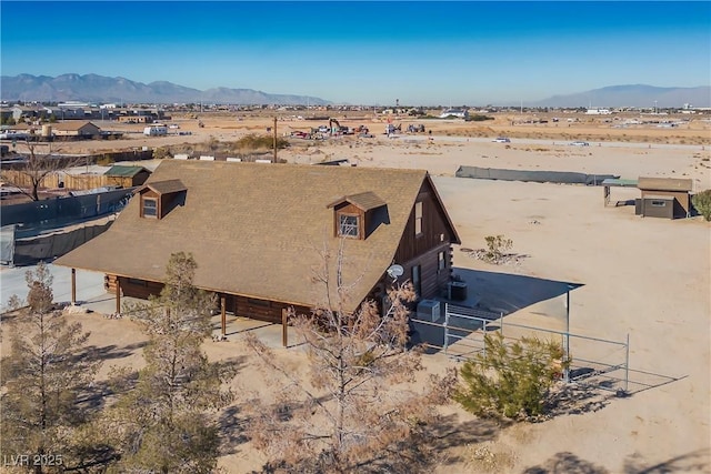 drone / aerial view featuring a mountain view