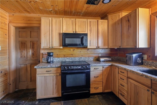 kitchen with wooden ceiling, wood walls, light brown cabinetry, and black appliances