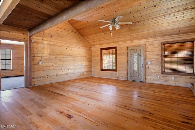 interior space with wood ceiling, beam ceiling, and light hardwood / wood-style floors