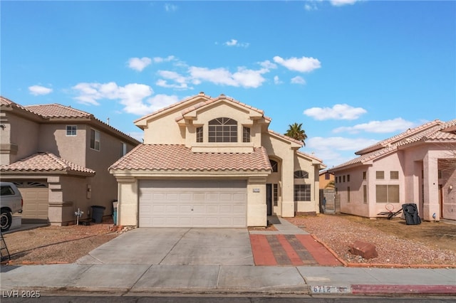 mediterranean / spanish-style home with a garage