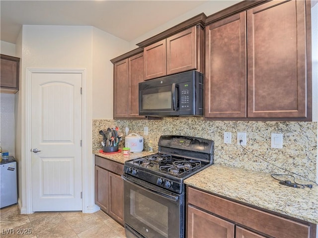 kitchen with tasteful backsplash, light stone countertops, light tile patterned floors, and black appliances