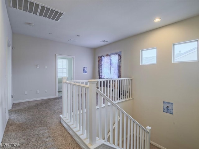 hallway with carpet