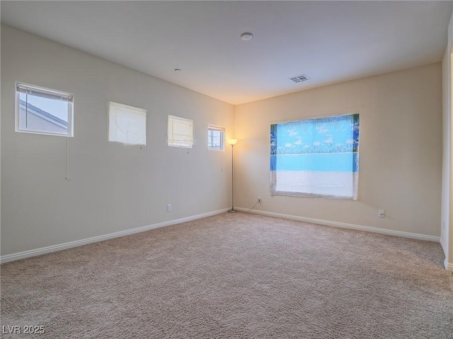 empty room featuring light colored carpet