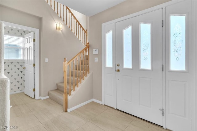 foyer entrance featuring light tile patterned floors