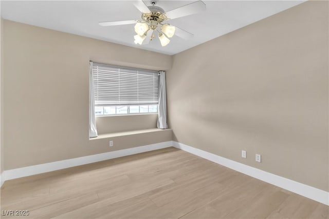 spare room featuring light hardwood / wood-style floors and ceiling fan