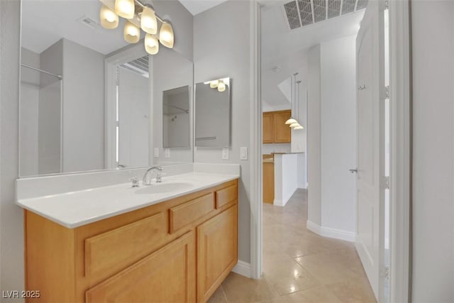 bathroom with tile patterned floors and vanity