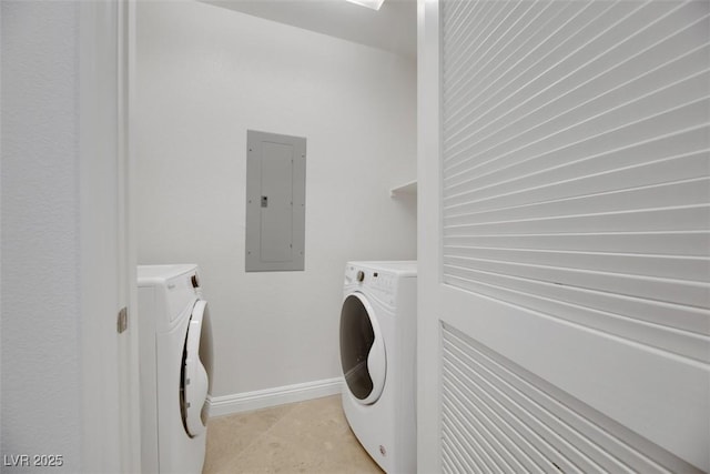 clothes washing area with separate washer and dryer, light tile patterned floors, and electric panel