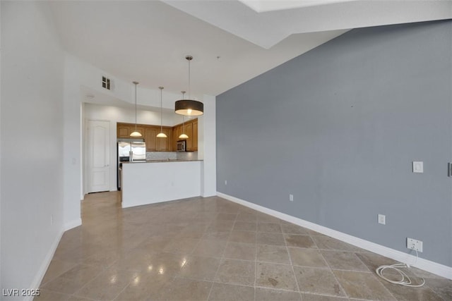 unfurnished living room with vaulted ceiling